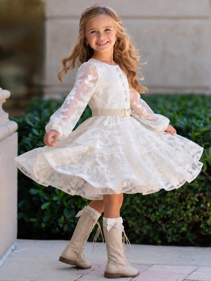 Girls textured floral dress with layered skirt and buckle belt.