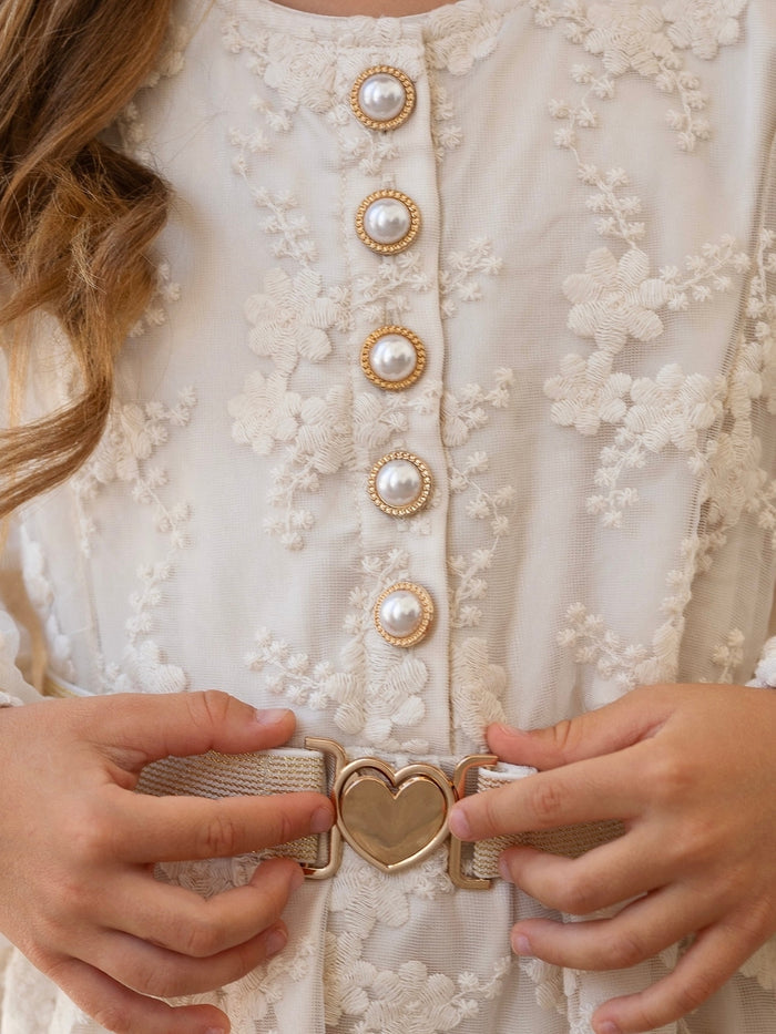 Girls long sleeve ivory dress with decorative button front and belt.