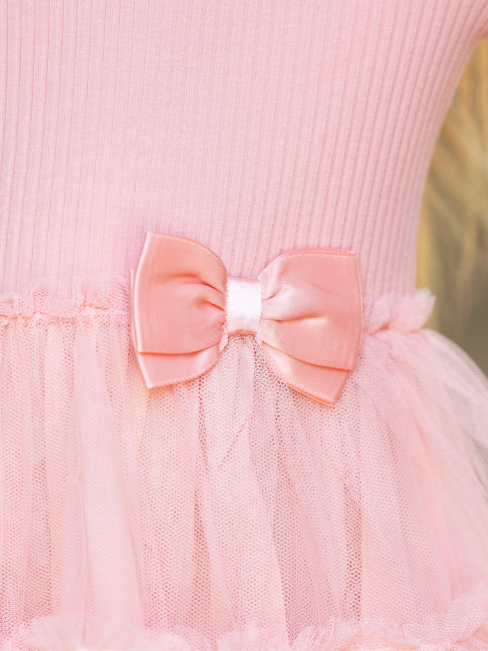 Girls blush long sleeve dress featuring a bow and tulle skirt